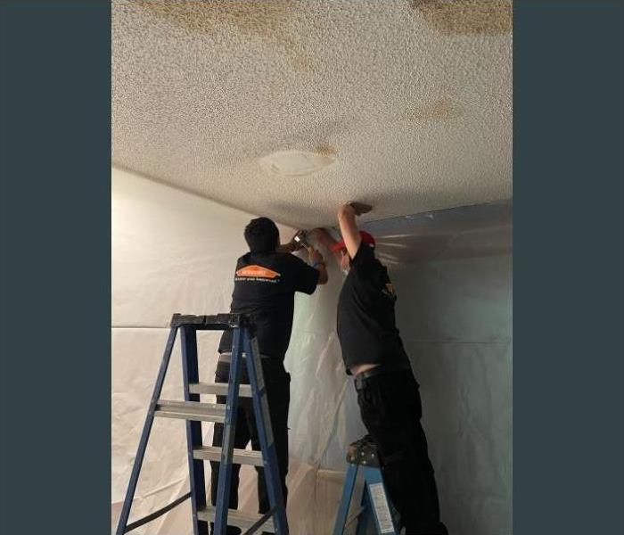 Our SERVPRO technicians preparing the room to get rid of the water stains.