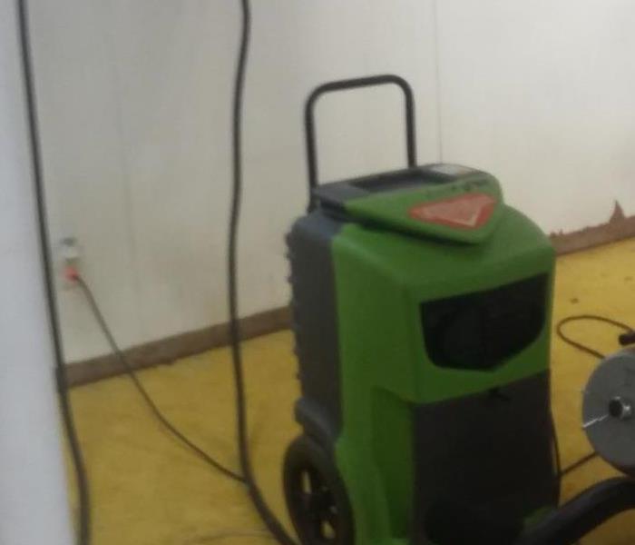 SERVPRO's drying equipment working in the basement