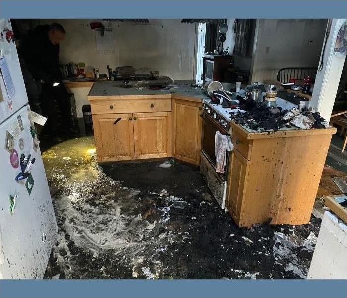 A kitchen with fire and soot damage in Saratoga Springs.