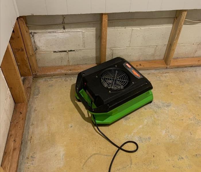 One of our SERVPRO air movers removing moisture from the air in a Saratoga basement.